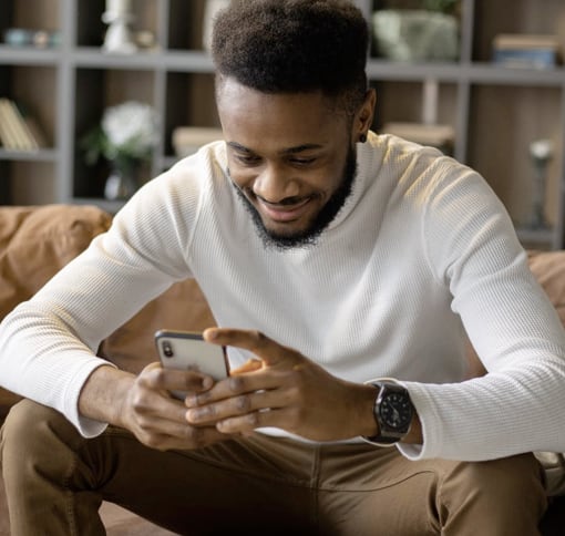 portrait of a man texting with a mobile phone