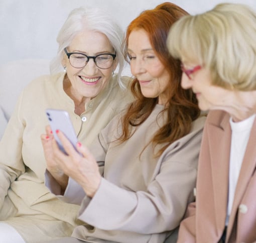 portrait containing 3 women videochatting with one mobile phone